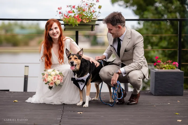 Dan, Oana, and Loki on their wedding day